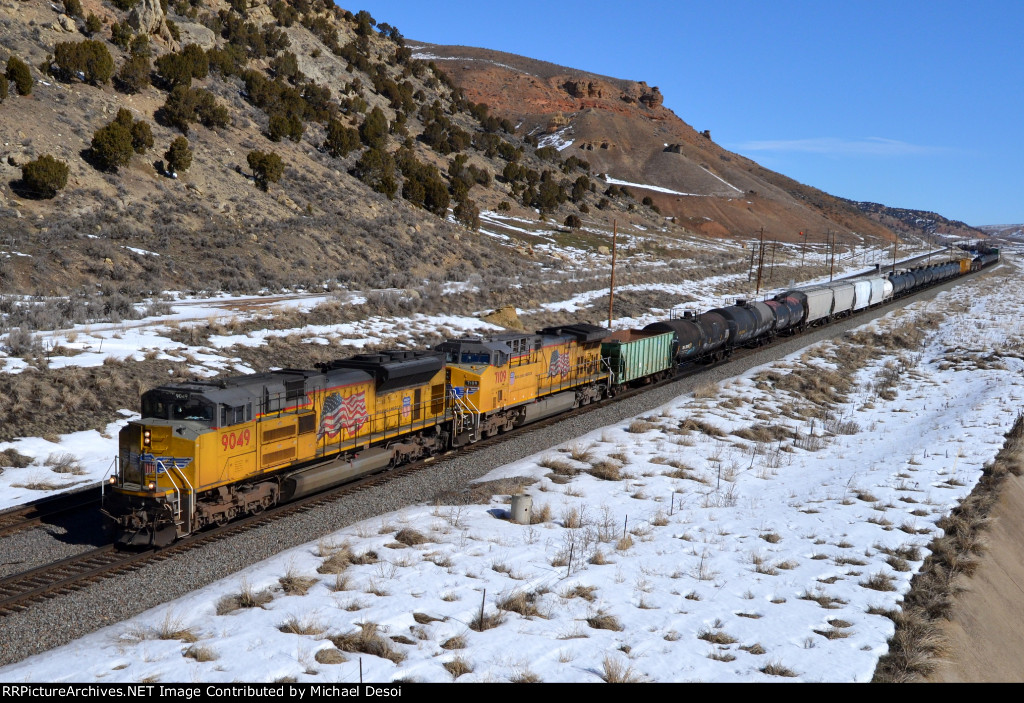 UP 9049, 7109 (SD70ACE, C44ACM) lead a westbound manifest approaching the Echo Rd. OHB in Emory, Utah. February 19, 2022 {Winter Echofest}